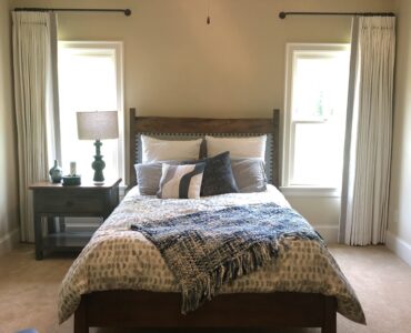 custom drapery with tape trim along leading edge