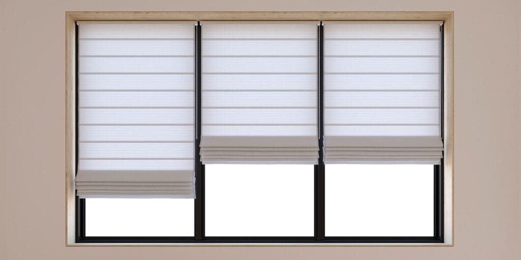 Three-panel window with white pleated blinds partially raised on all panels, revealing a bright, evenly lit background. The window has a light wooden frame.