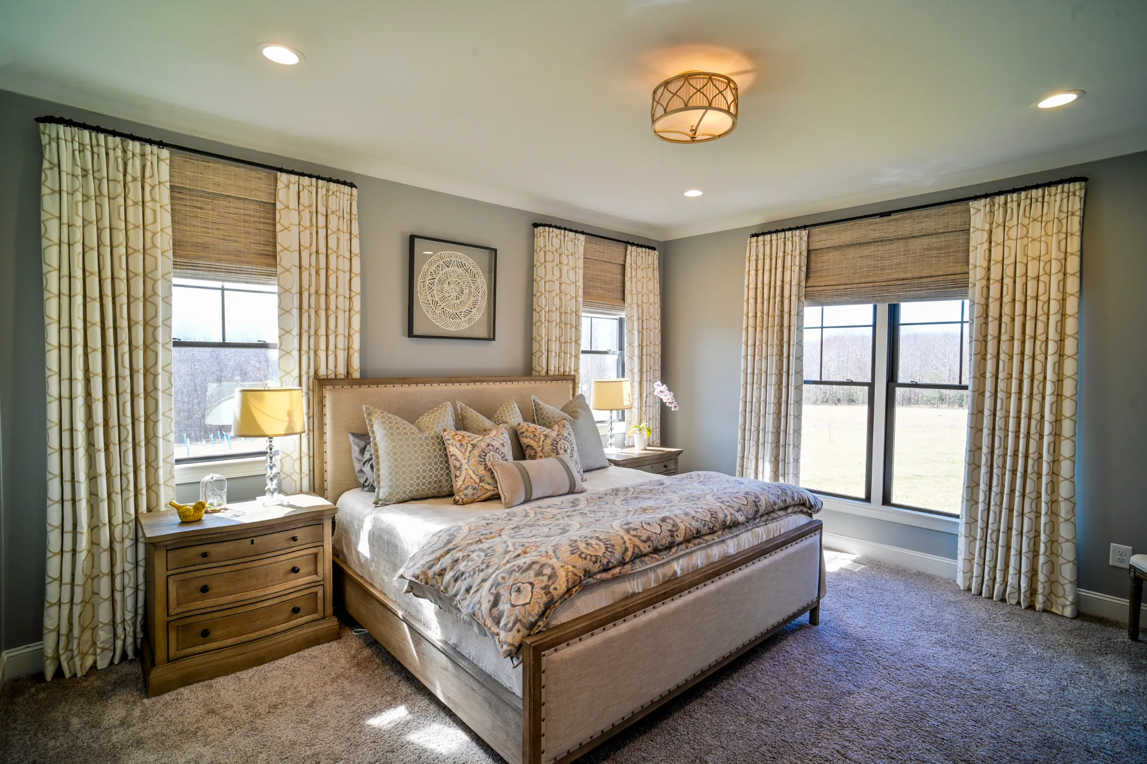 Custom woven wood shades in a bedroom providing natural light filtering and privacy