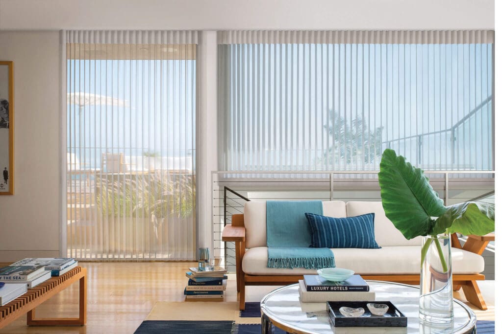 Hunter Douglas Silhouette® Shades on windows and Luminette® Privacy Sheers on a sliding patio door in a modern Jamestown, NC living room.