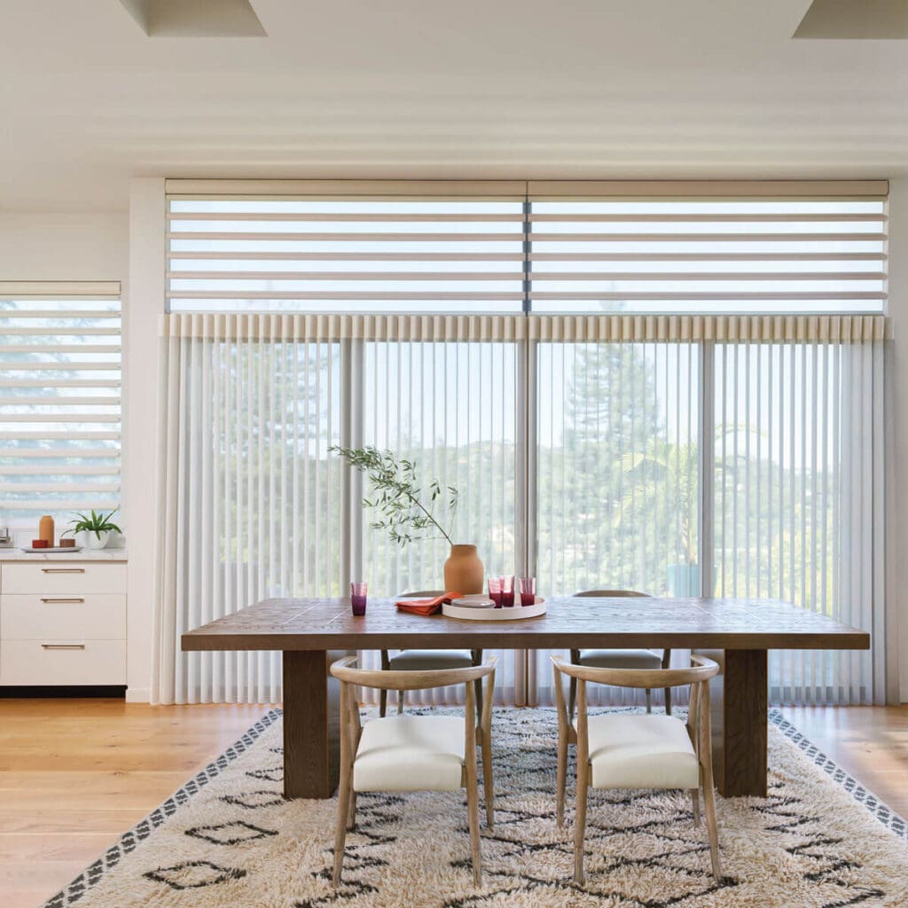Hunter Douglas Luminette® Privacy Sheers and Pirouette® Window Shadings in a dining room in Jamestown, NC.