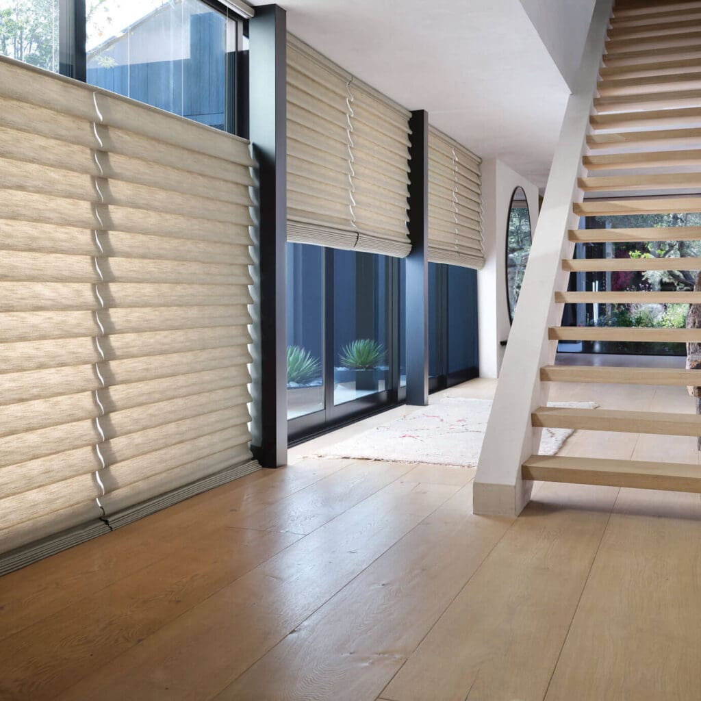 Hunter Douglas Vignette® Roman Shades with PowerView Automation in a hallway with stairs in NC.