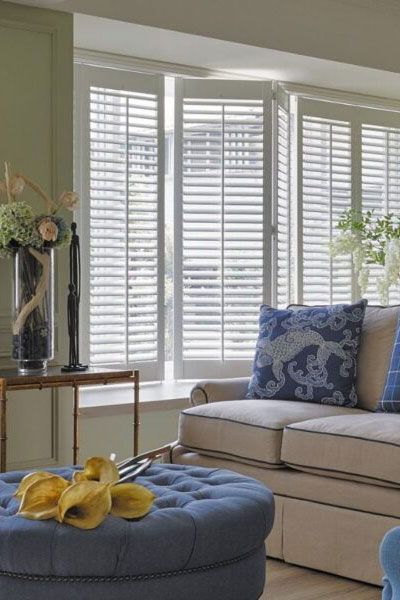 Custom upholstered chair and pillows in a bedroom by Window Works Studio in Jamestown, NC.