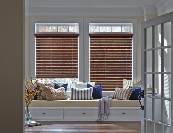 Hunter Douglas EverWood® Alternative Wood Blinds in a bay window with a built-in window seat in Jamestown, NC.
