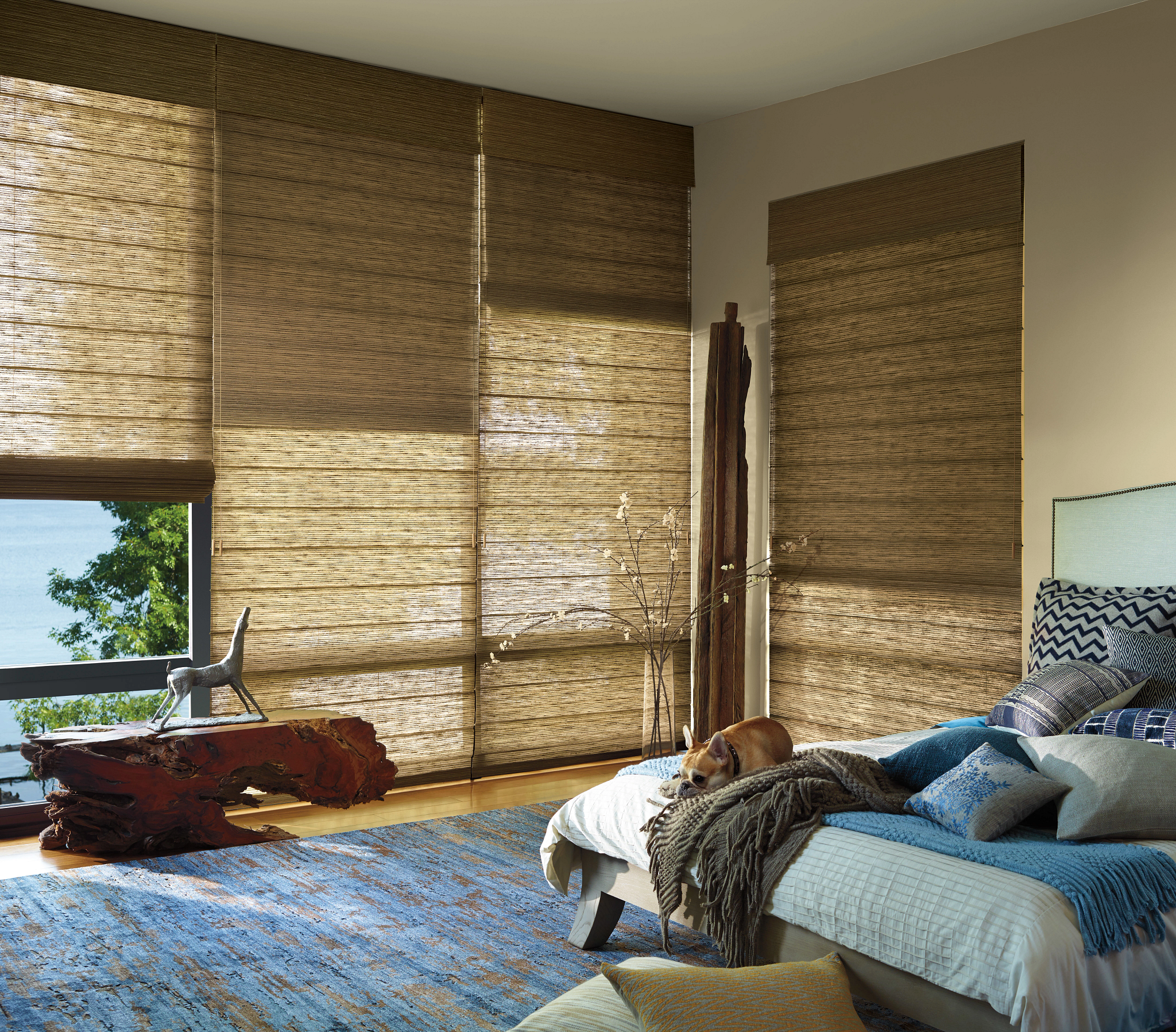 Bedroom with woven shades providing privacy and filtered natural light